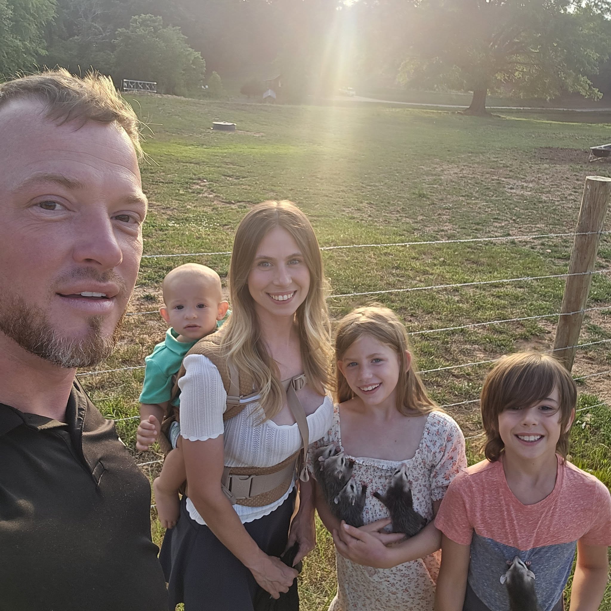 The family behind Blackline Ranch together outdoors at the ranch